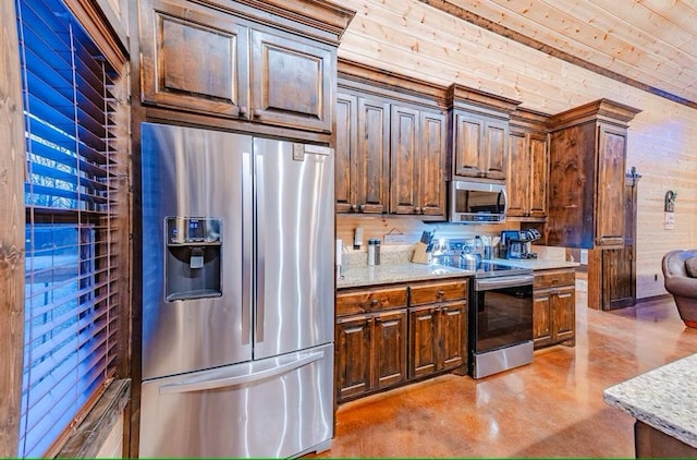 kitchen with appliances with stainless steel finishes, light stone counters, and wood ceiling