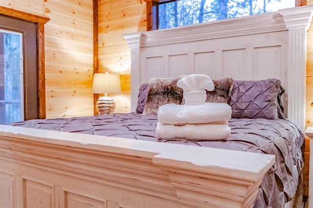 bedroom with wooden walls