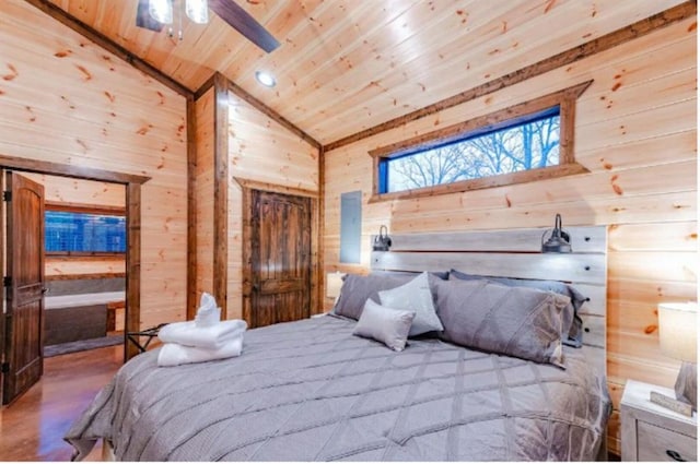 bedroom with high vaulted ceiling, wooden walls, and wood ceiling