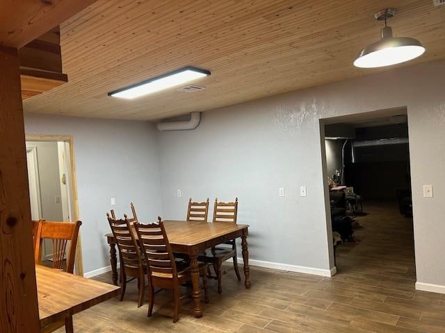 dining space with dark wood-type flooring