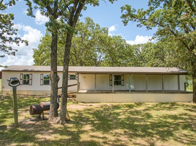 355650 E 990th Rd, Prague, OK 74864 - view of front of house with a front lawn and covered porch
