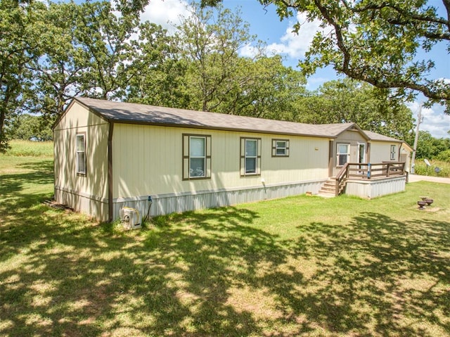 355650 E 990th Rd, Prague, OK 74864 - view of front of house featuring a wooden deck and a front yard