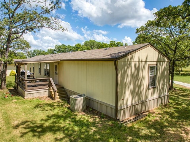 355650 E 990th Rd, Prague, OK 74864 - view of home's exterior featuring a lawn and a deck