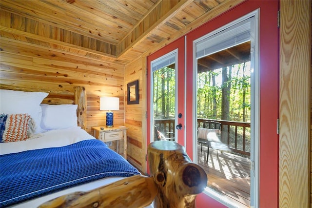 bedroom featuring wooden walls and wood ceiling