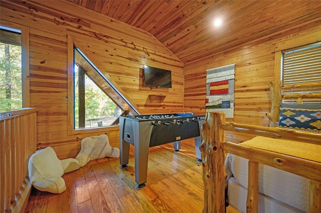 rec room with hardwood / wood-style flooring, plenty of natural light, wooden ceiling, and vaulted ceiling