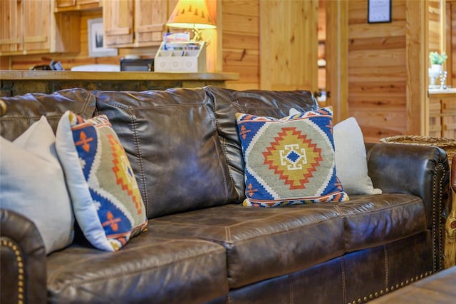 living room featuring wood walls