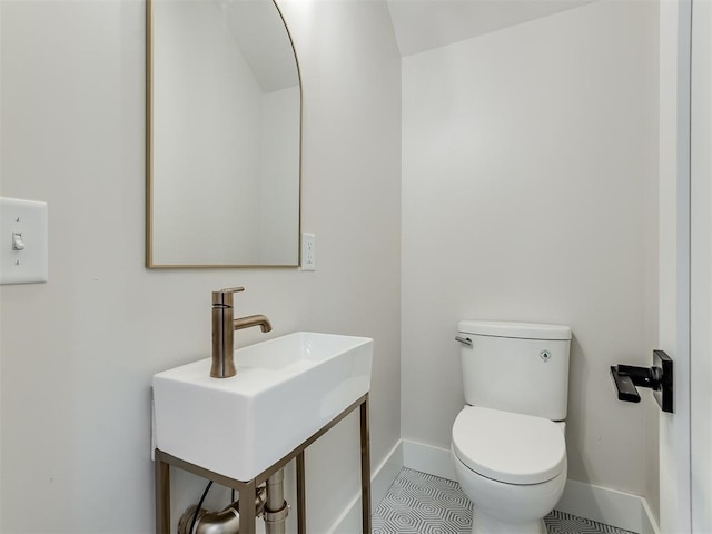 bathroom featuring tile patterned flooring and toilet