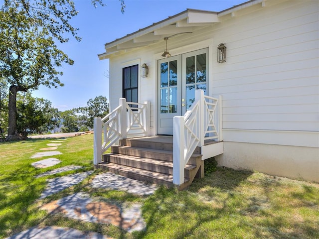 entrance to property featuring a yard