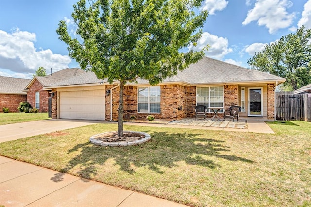 ranch-style home featuring a garage, a patio, and a front lawn