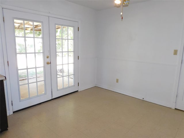 doorway to outside featuring french doors and ceiling fan