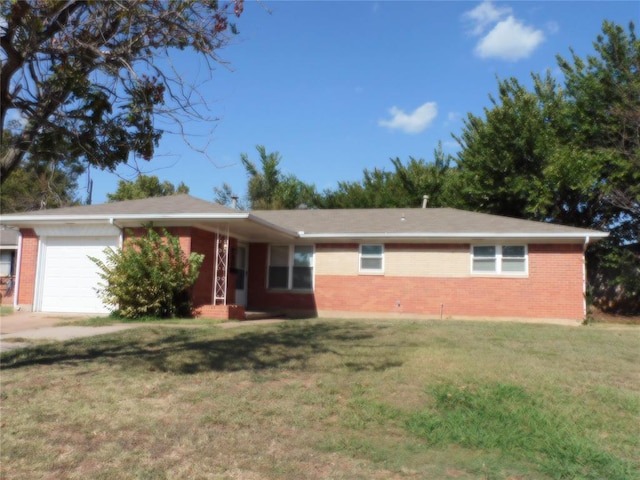 ranch-style house featuring a front yard and a garage