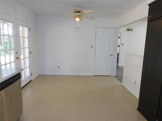 empty room featuring french doors and ceiling fan