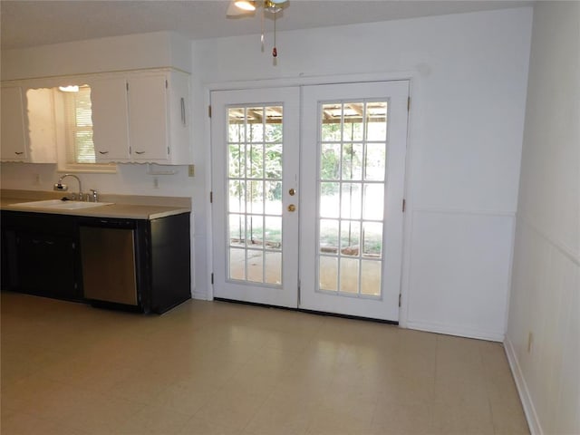 entryway with french doors, ceiling fan, and sink