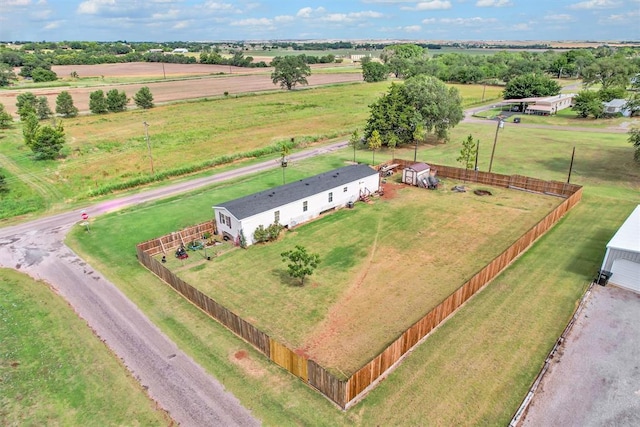 birds eye view of property with a rural view