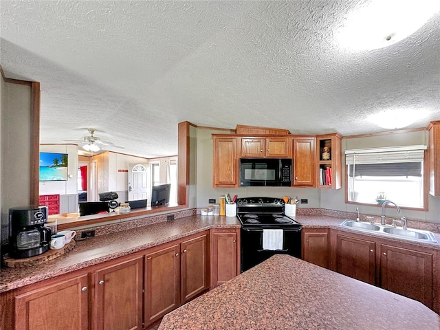 kitchen with a textured ceiling, sink, ceiling fan, and black appliances