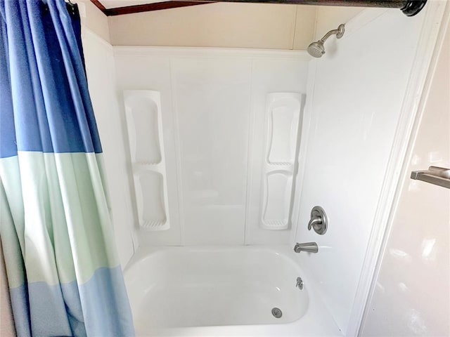 bathroom featuring shower / bathtub combination with curtain