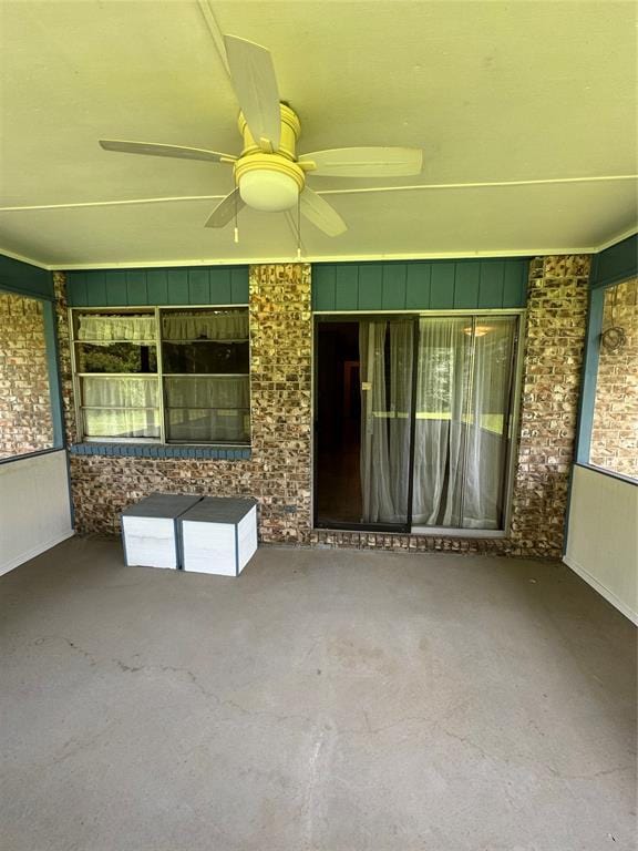 interior space with ceiling fan