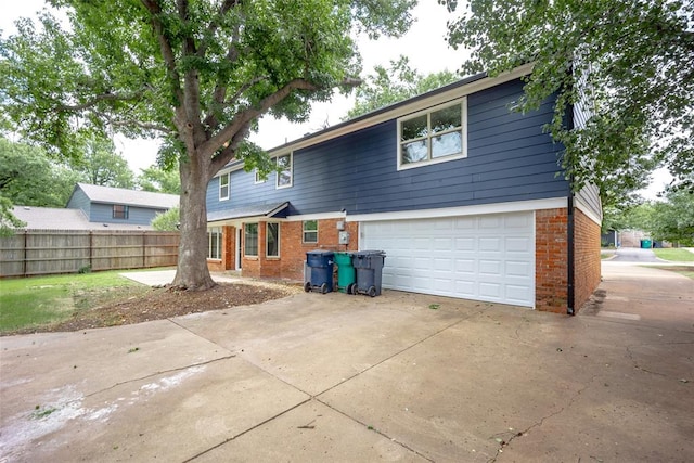 rear view of house with a garage