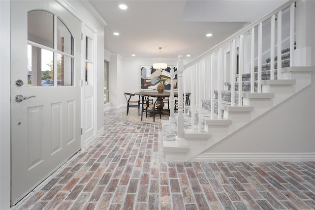 entrance foyer with an inviting chandelier