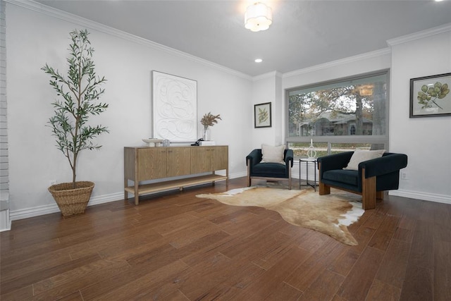 sitting room featuring dark hardwood / wood-style floors and crown molding