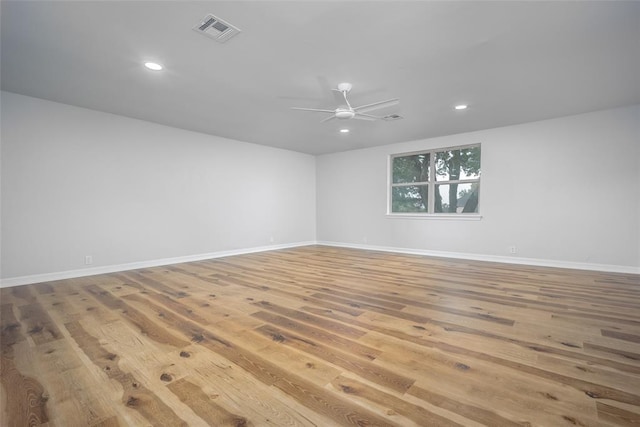 unfurnished room with ceiling fan and light hardwood / wood-style floors