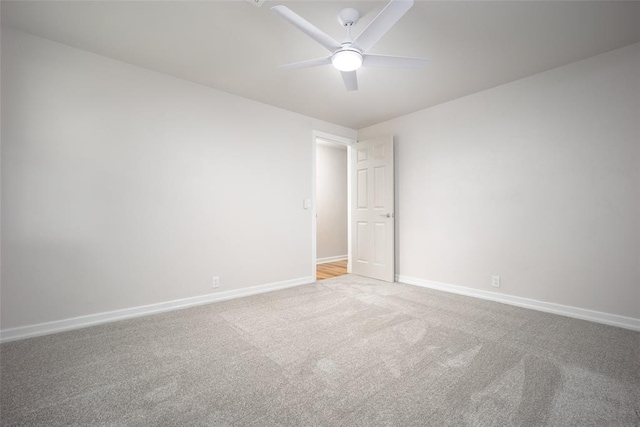 empty room featuring light carpet and ceiling fan