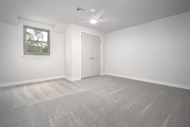 unfurnished bedroom with carpet, a closet, and ceiling fan