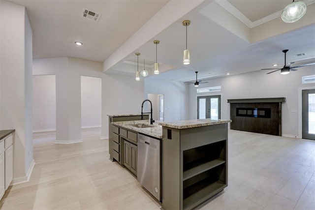 kitchen with dishwasher, sink, hanging light fixtures, french doors, and a kitchen island with sink