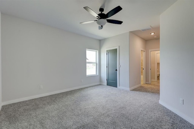 unfurnished bedroom with ceiling fan and light carpet