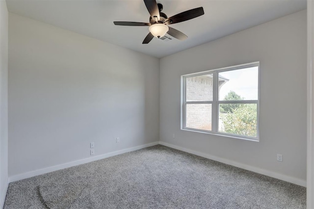 spare room featuring carpet floors and ceiling fan