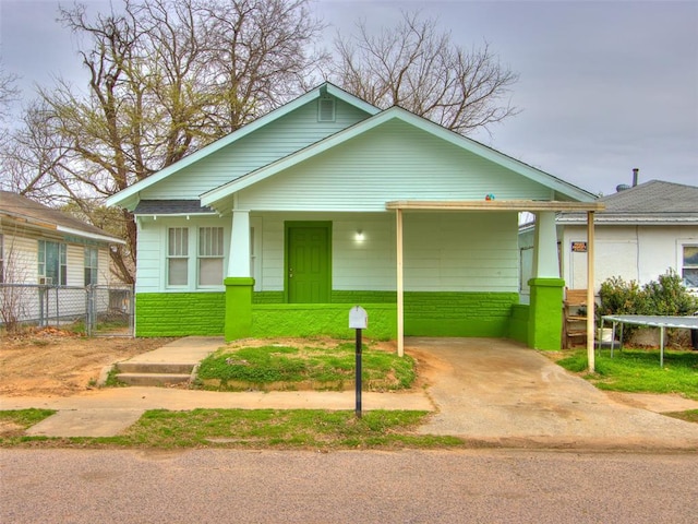 bungalow-style home with a trampoline