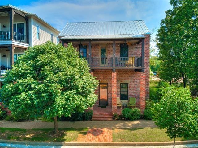 view of front of home with a balcony