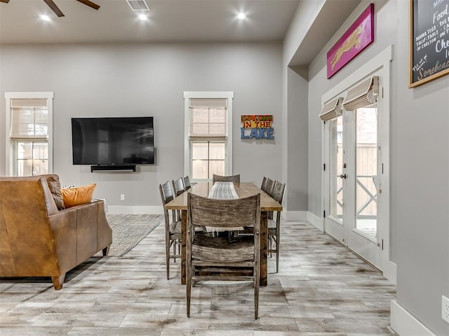 dining space featuring ceiling fan and light hardwood / wood-style flooring