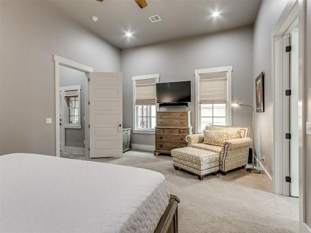 bedroom featuring light carpet and ceiling fan