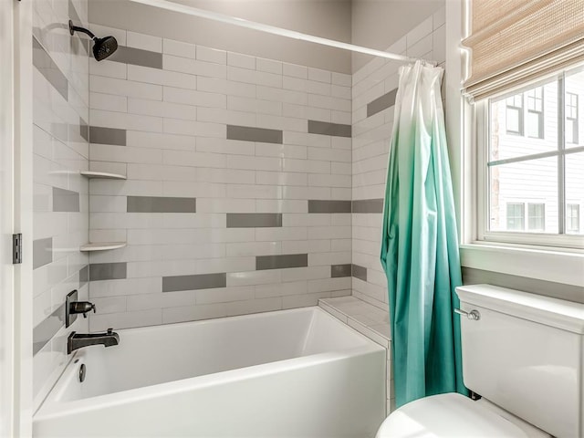 bathroom featuring toilet and shower / tub combo