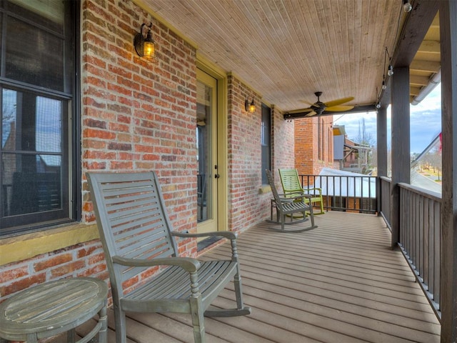 deck with a porch and ceiling fan