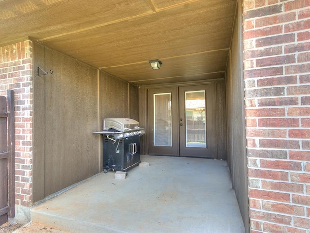 view of exterior entry featuring french doors