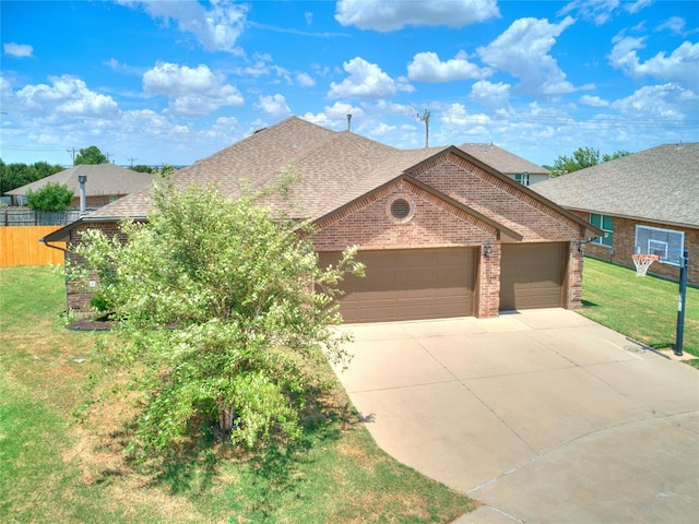 view of front of house featuring a garage and a front lawn