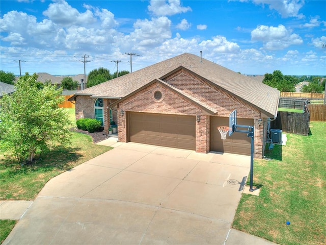 single story home featuring a front lawn and a garage