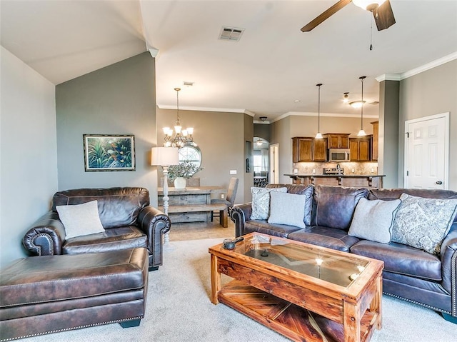 carpeted living room featuring vaulted ceiling, ceiling fan with notable chandelier, and ornamental molding