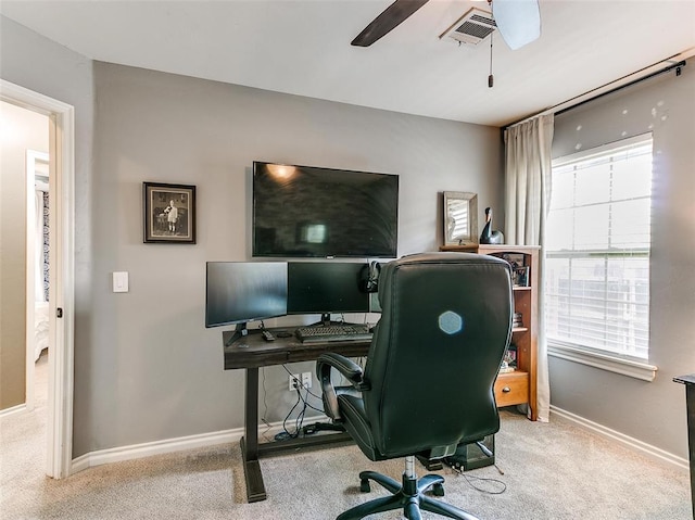 carpeted home office with ceiling fan