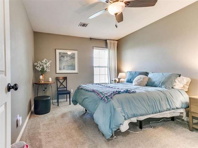 bedroom with light carpet and ceiling fan