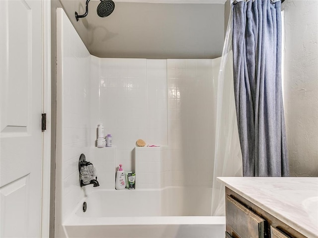 bathroom with shower / tub combo and vanity