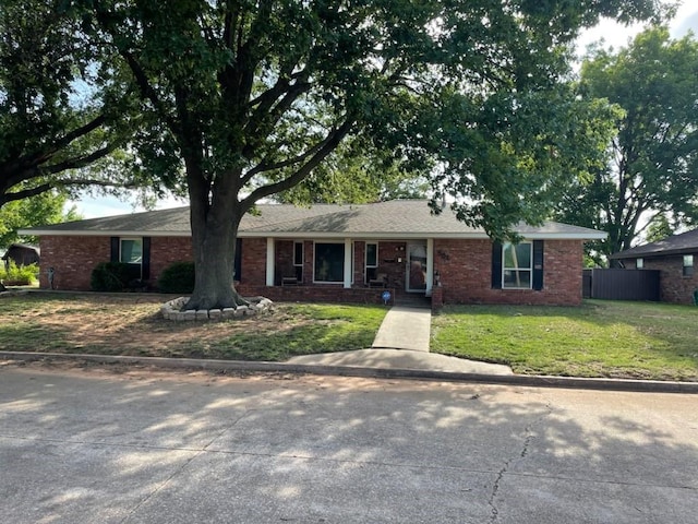 ranch-style house with a front lawn