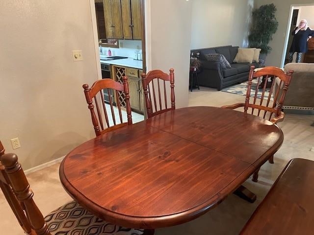 view of carpeted dining space