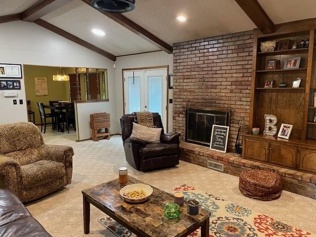 carpeted living room featuring a fireplace and lofted ceiling with beams