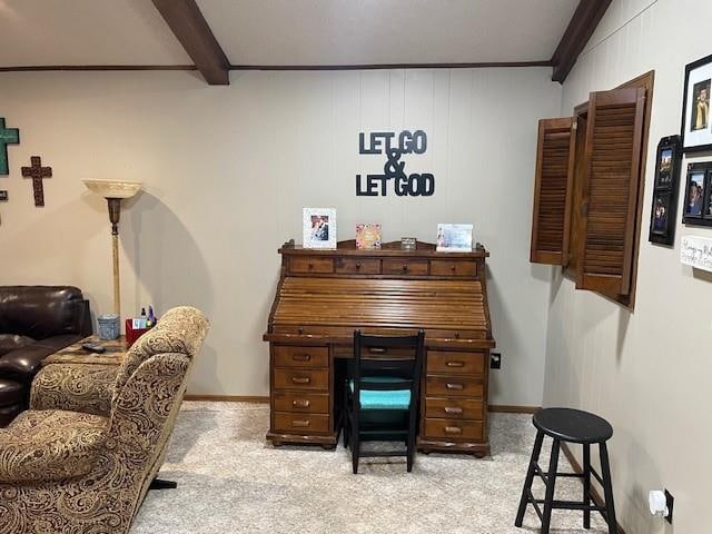 office area featuring beam ceiling, light colored carpet, and ornamental molding