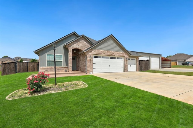 view of front facade featuring a front lawn and a garage