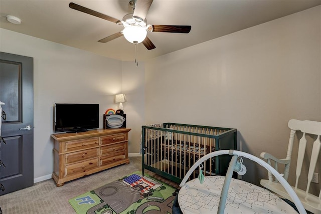 carpeted bedroom with ceiling fan