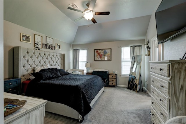 carpeted bedroom featuring ceiling fan and vaulted ceiling